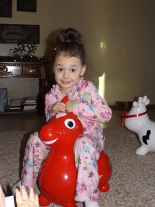Sawyer on her new bouncing horse? donkey? something...