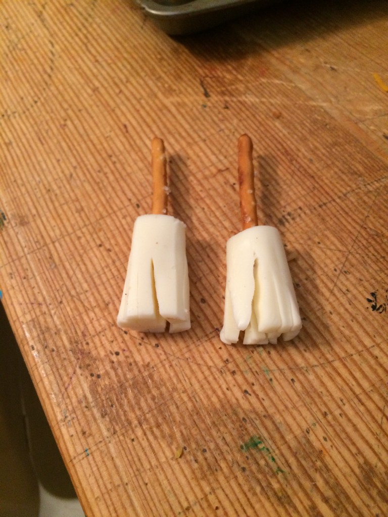 Witch's brooms (cheese sticks and pretzels)