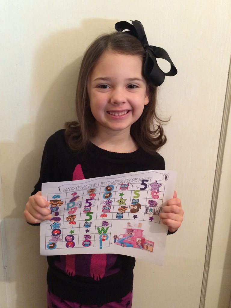 With her completed chore chart!